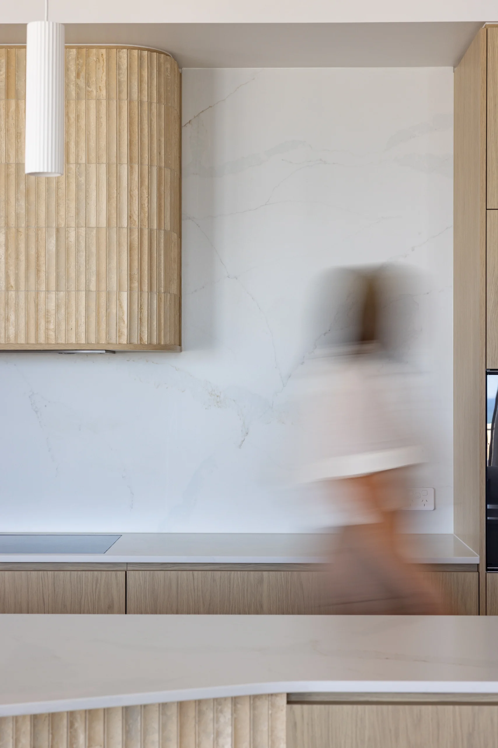 Modern kitchen with marble benchtop and motion blur